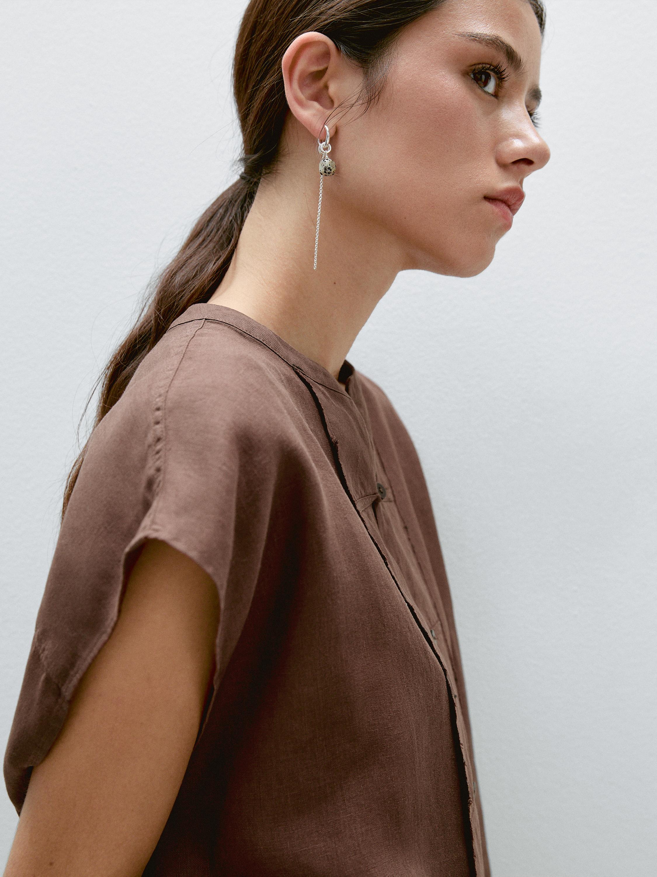 Veste sans manches plastron boutonné